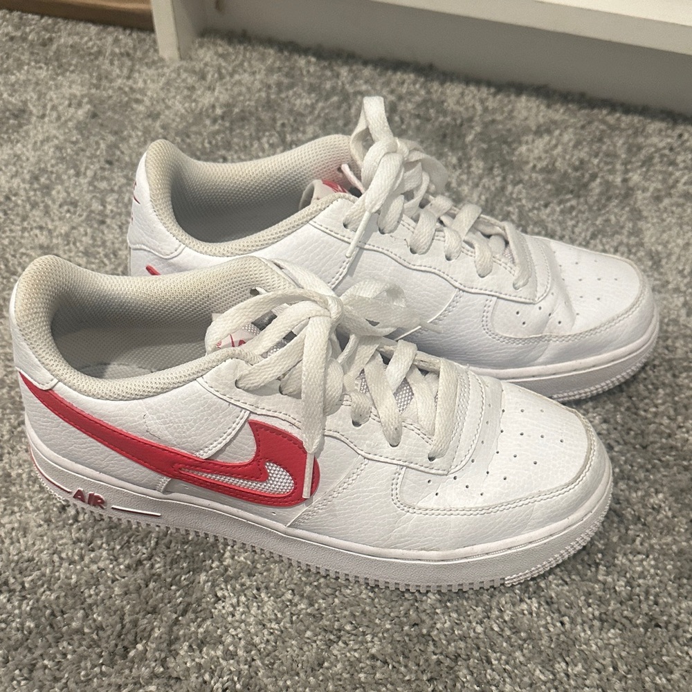 Nike Big Kids White Sneakers with Red Swoosh Accent